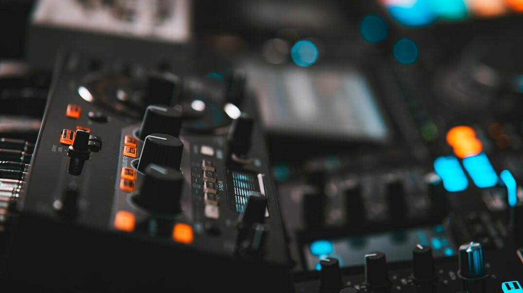 Audio and video mixing console with faders and buttons