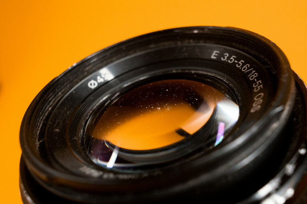 Close-up of a camera lens with reflections