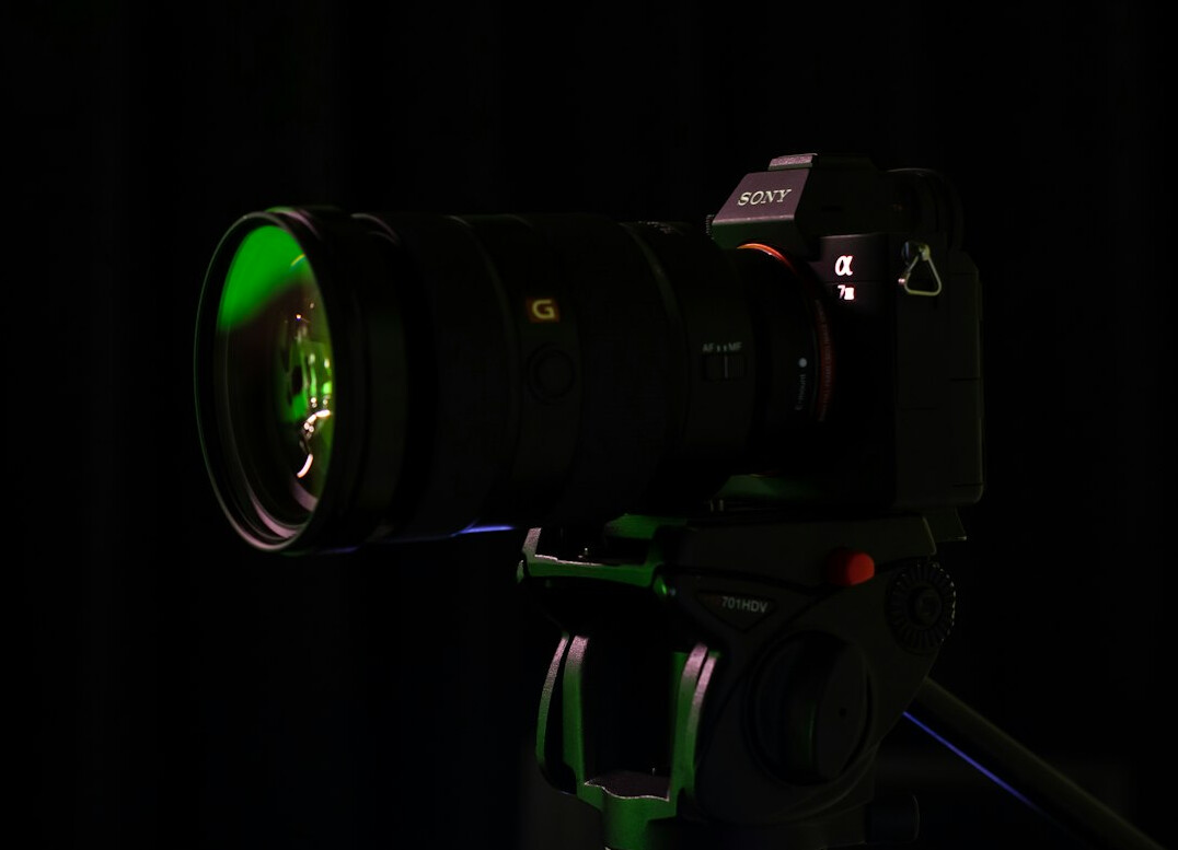 Professional broadcast video camera with a large lens in a television studio