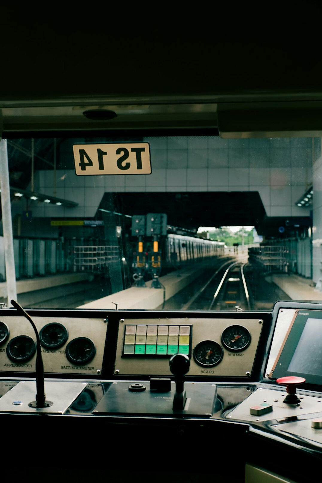 Monitoring screens showing signal graphs and dashboards