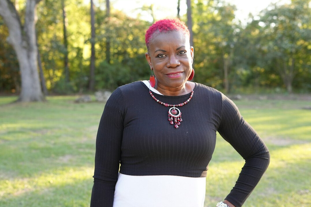Portrait of a Black woman in business attire smiling