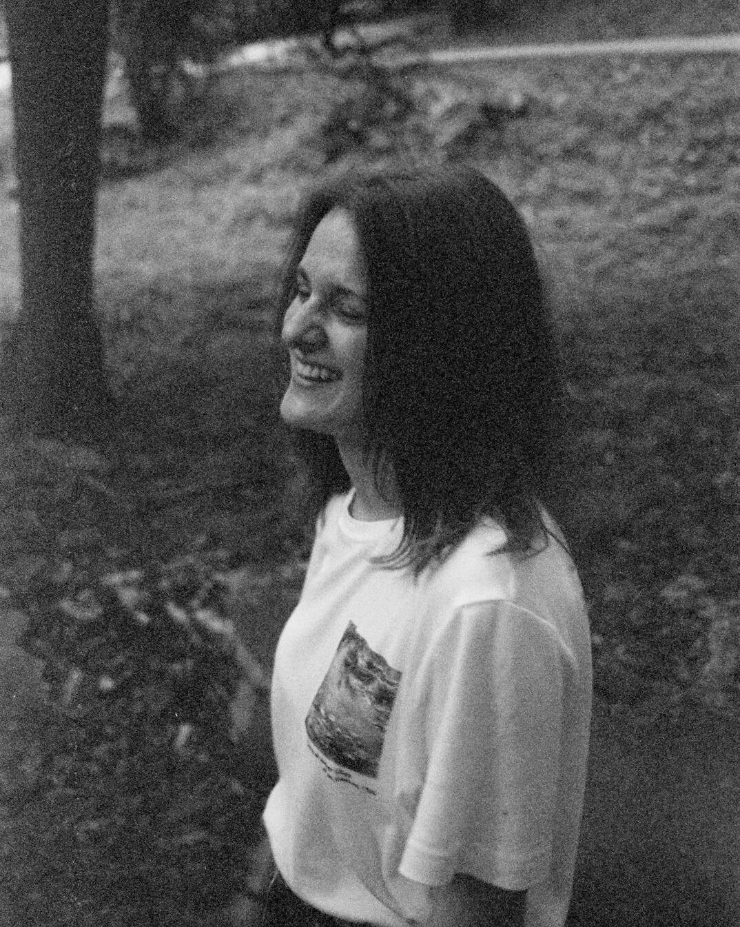 Portrait of a woman with shoulder-length hair smiling